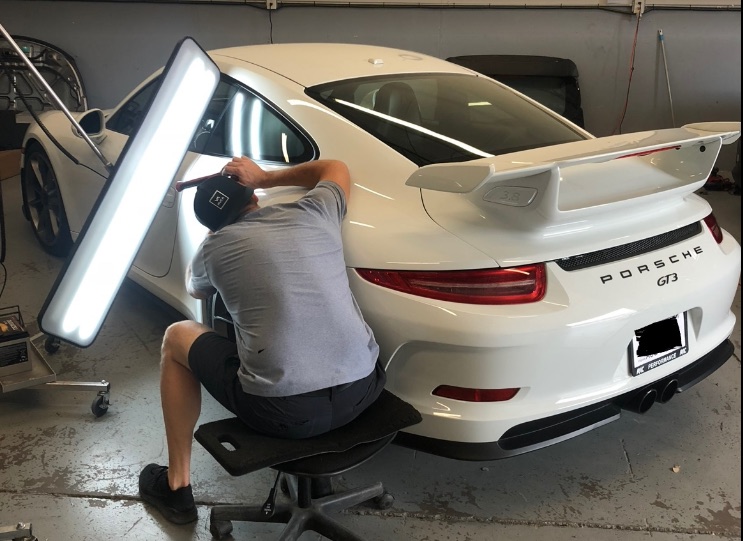 Paintless dent repair in progress on a vehicle in Tyler, TX